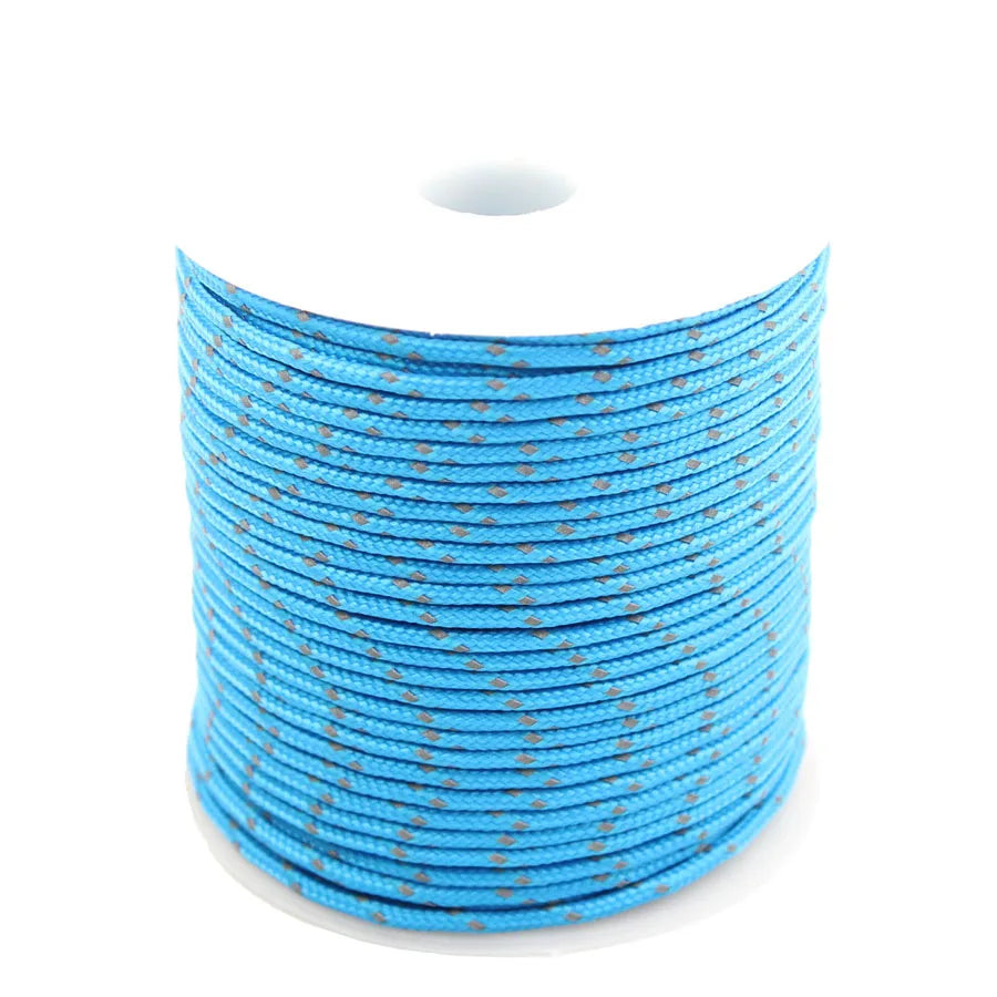 Spool of bright blue high-visibility reflective paracord coiled on a white background