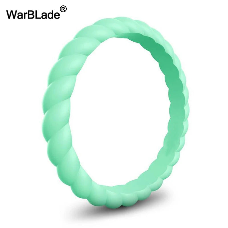A close-up view of a light green braided silicone ring.