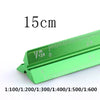 A green aluminium triangular scale ruler marked in centimeters and millimeters.