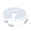 White foam door stopper with finger pinch protection, measuring 9.5cm in height and 9.2cm wide.