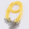 A bundle of yellow leather cord necklace with silver clasps.