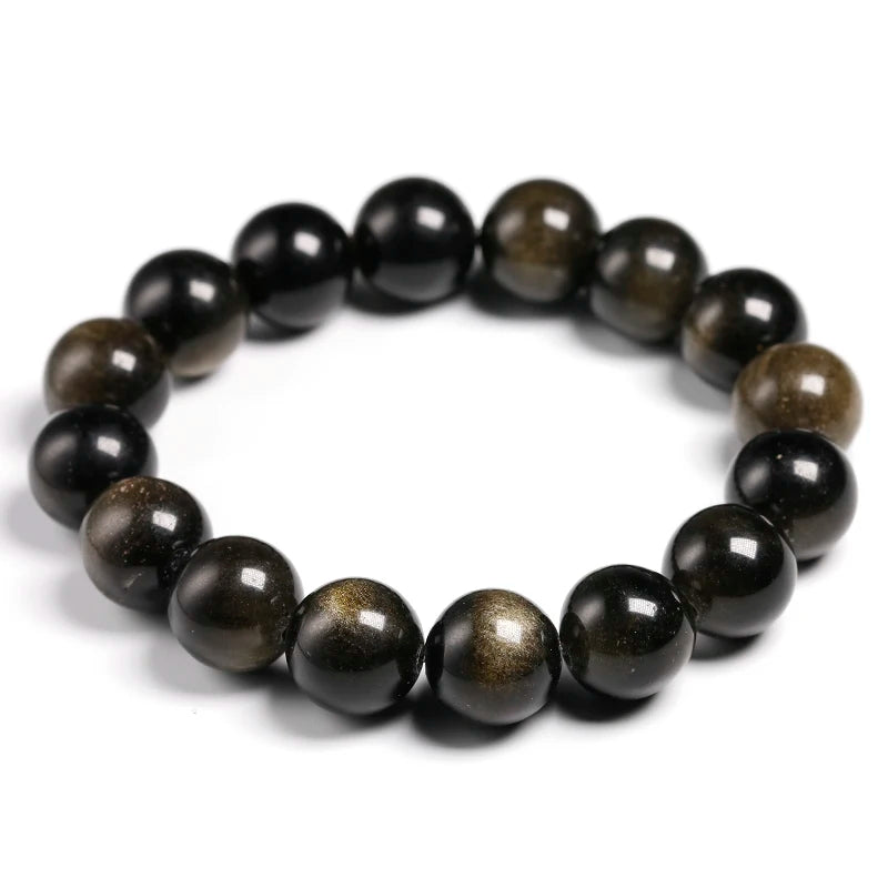 A stretch bracelet made of natural black and gold obsidian gemstones.
