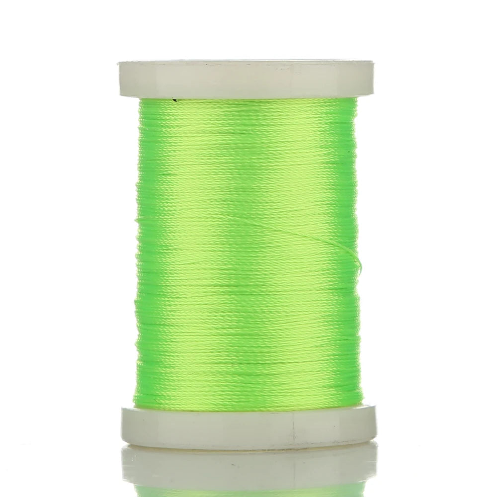 A spool of bright lime green braided polyester thread for guide tying and repairs.