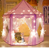 A pink foldable princess tipi play tent decorated with fairy lights and sheer fabric, featuring a bear and a bunny.