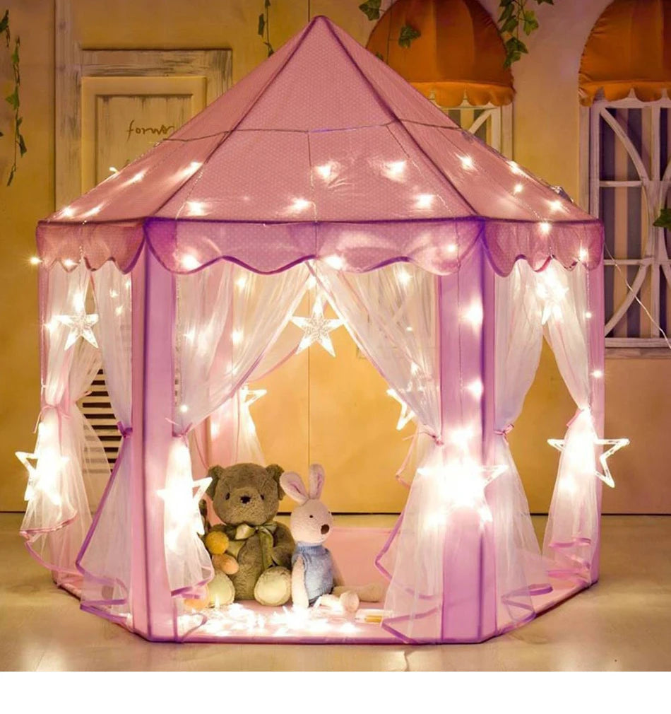 A pink foldable princess tipi play tent decorated with fairy lights and sheer fabric, featuring a bear and a bunny.