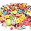Assortment of eco-friendly wooden buttons in various colors and sizes for sewing and crafts