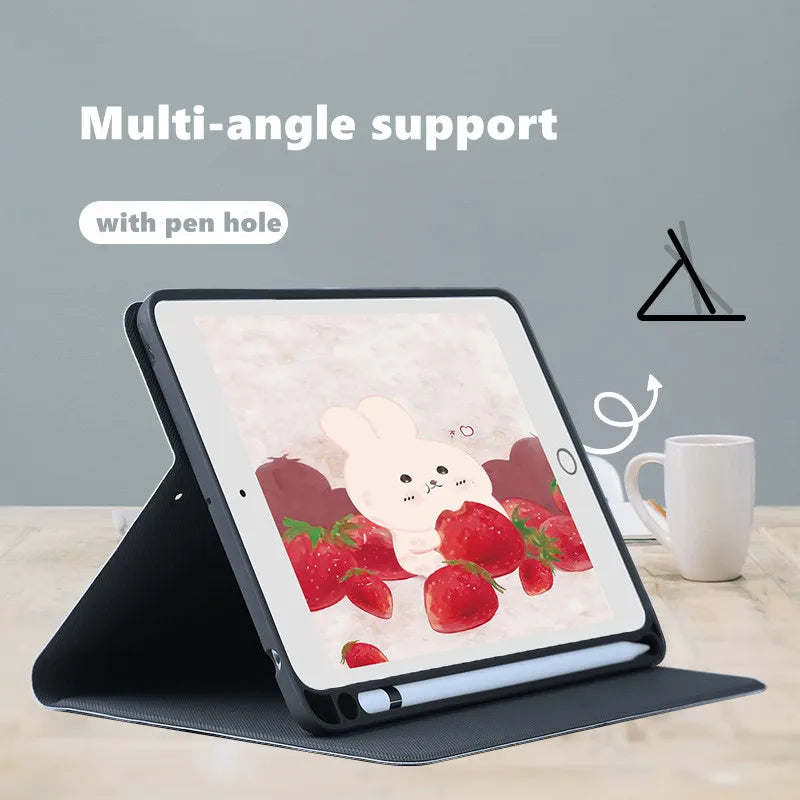 A black multi-angle support case for an iPad with a pen hole, featuring a pink composition notebook design.