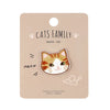 A beige tag featuring an embroidered cat face patch with the text Cats Family and a meow sound.