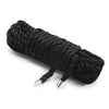 A coil of black Shibari bondage rope used for couples play.