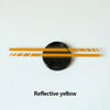 A black circular decal with horizontal reflective yellow stripes on a white background.