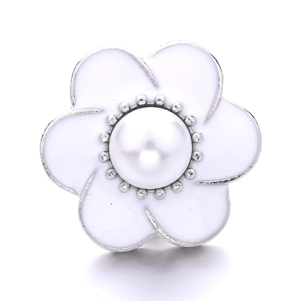 A white flower-shaped metal snap button with a central pearl detail for jewelry making.