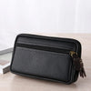 Black men's multi-function PU leather waist bag with a zipper and leather strap resting on a wooden surface.