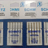 Pack of five universal sewing machine needles labeled SCHMETZ for various brands