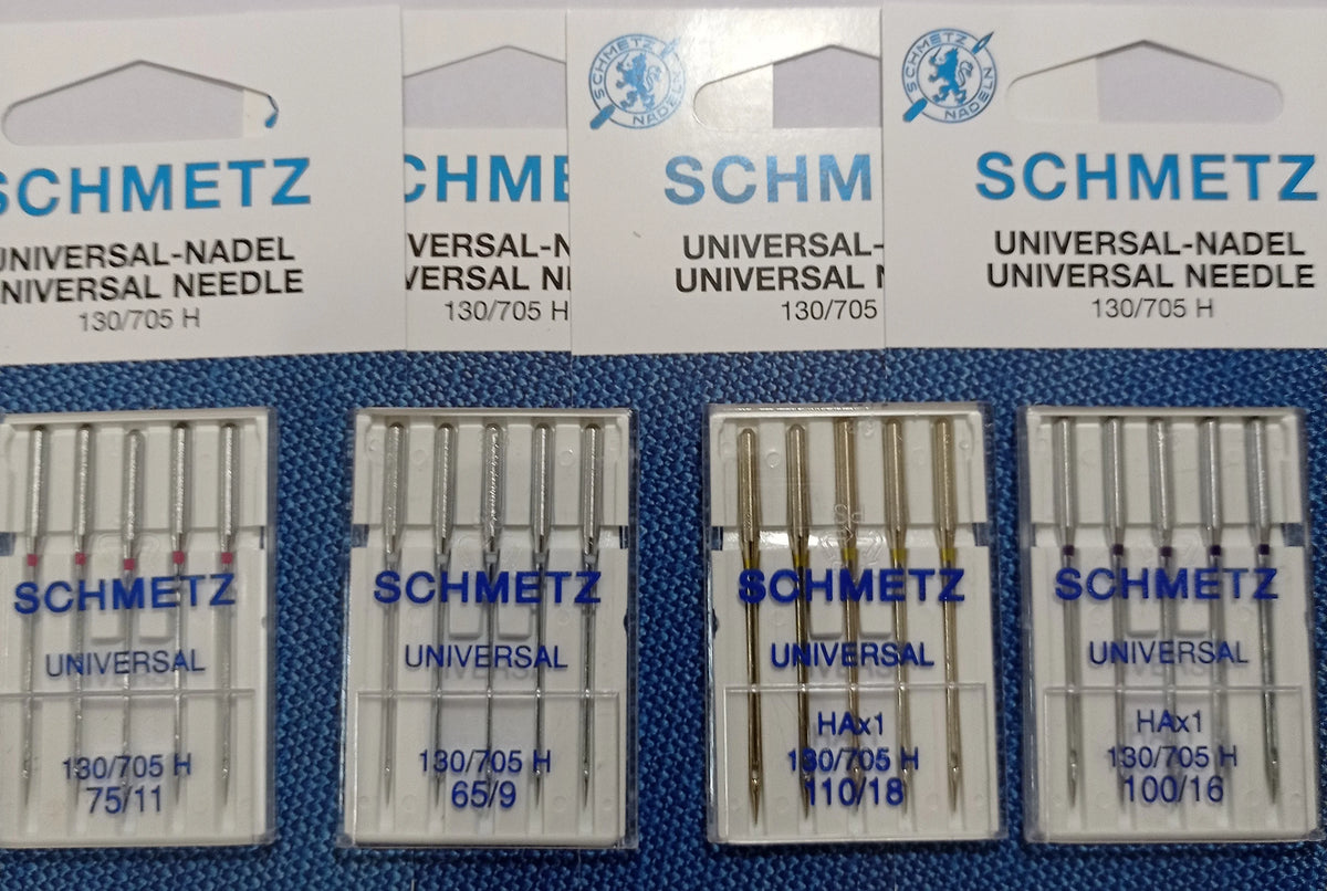 Pack of five universal sewing machine needles labeled SCHMETZ for various brands