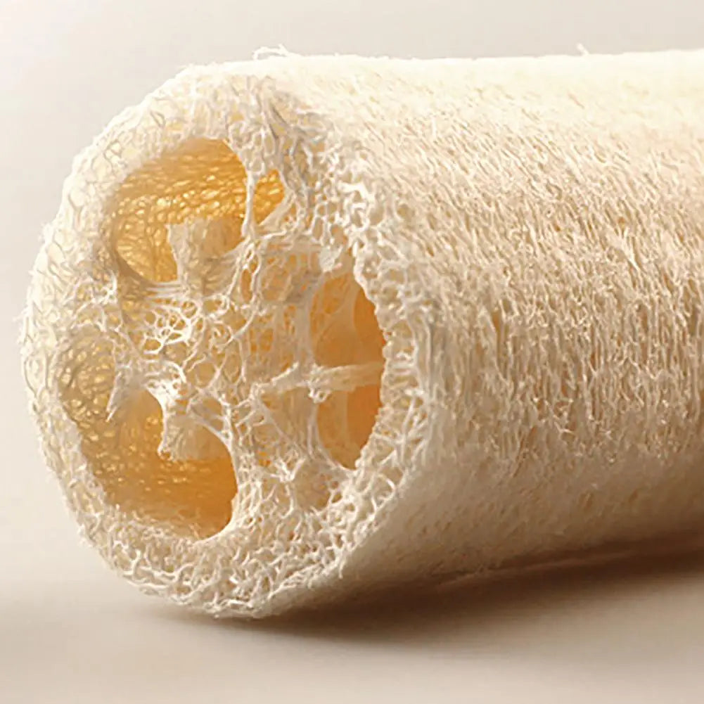A roll of natural loofah scrubber sponges showing the fibrous interior texture.