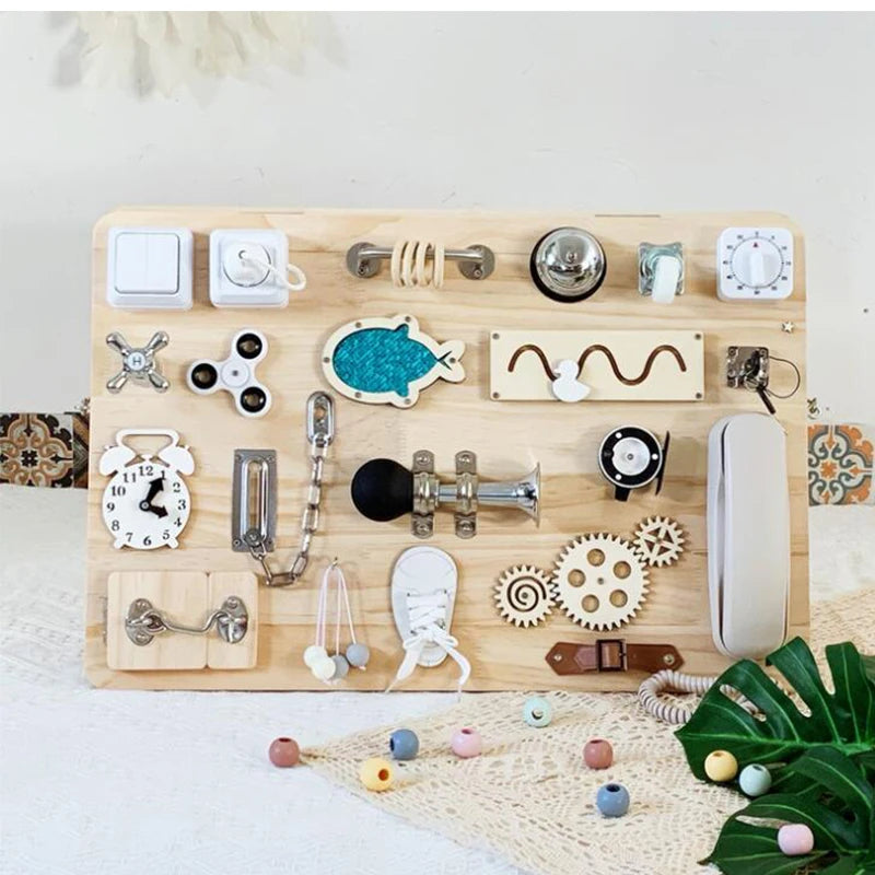 A wooden Montessori busy board featuring various natural and tactile learning accessories for toddlers.