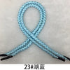 A blue braided string rope with a knot pattern is shown against a white background.
