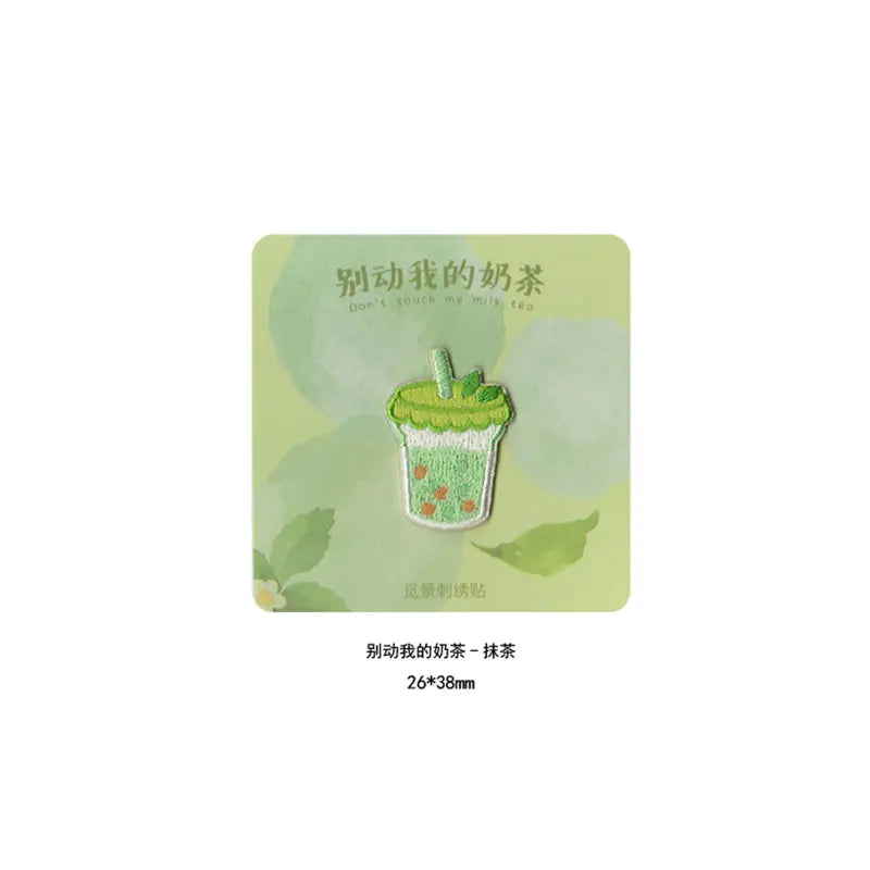 A light green embroidered patch depicting a green ice cream cone with a mint leaf on top.