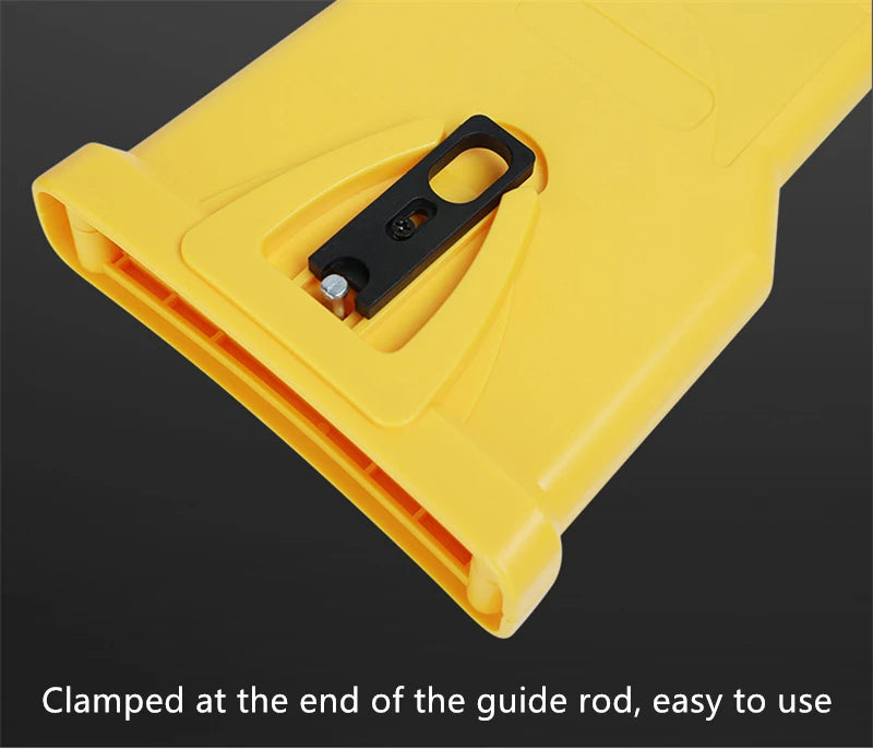 Yellow portable chainsaw sharpener with a black handle clamped at the end of the guide rod