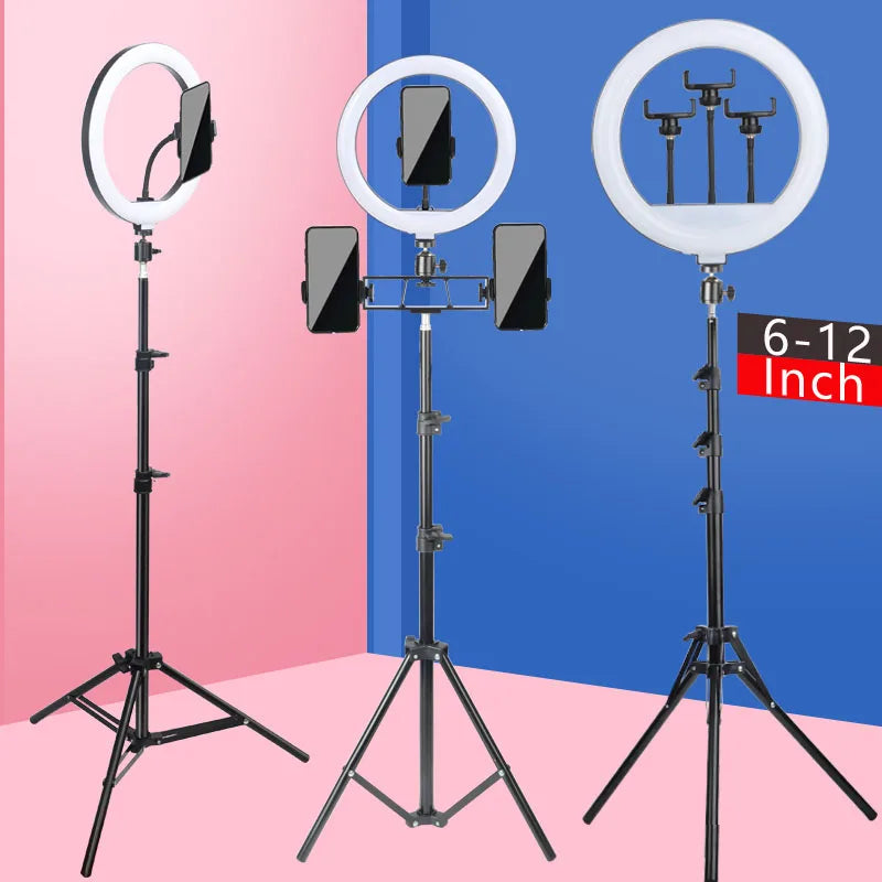 Three adjustable ring lights with tripods and phone holders shown against a pink and blue background.