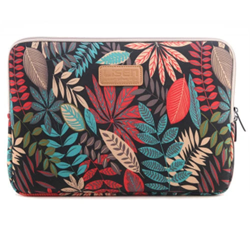 A black laptop sleeve featuring a vibrant tropical leaf pattern with pink and green accents.