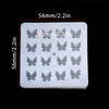 A white epoxy resin mold with multiple butterfly-shaped cavities for DIY jewelry making.