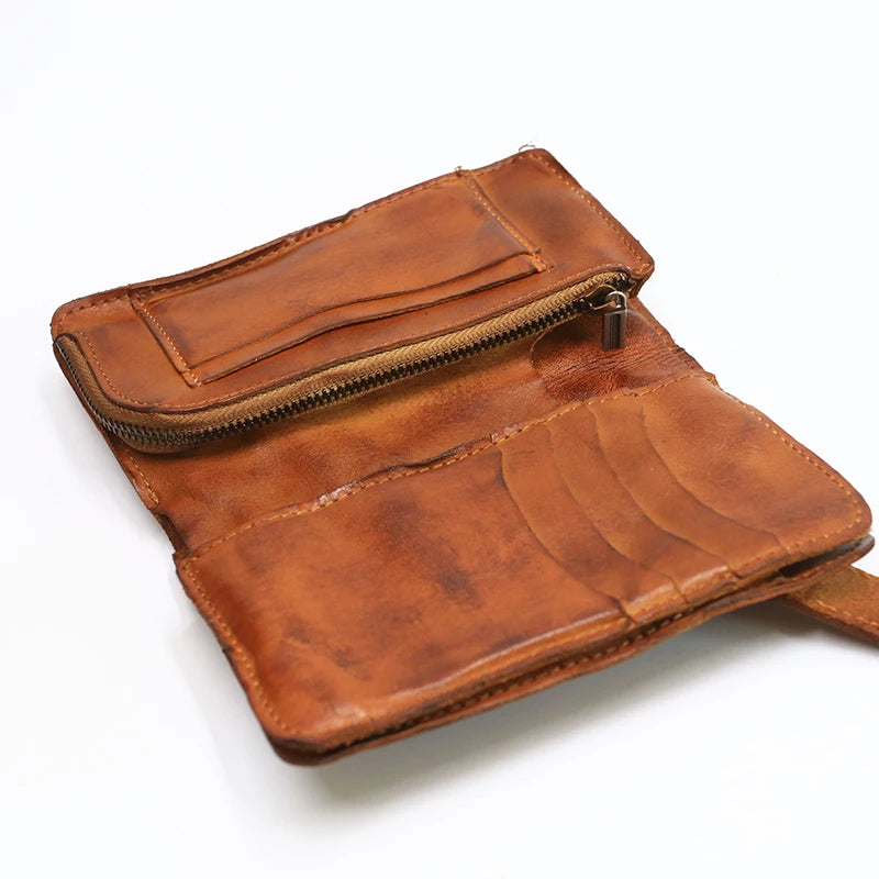 A brown vintage cowhide leather bi-fold wallet with a stitched flap and zipper.