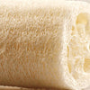 A roll of natural loofah scrubber sponges showing the fibrous texture and light beige color.