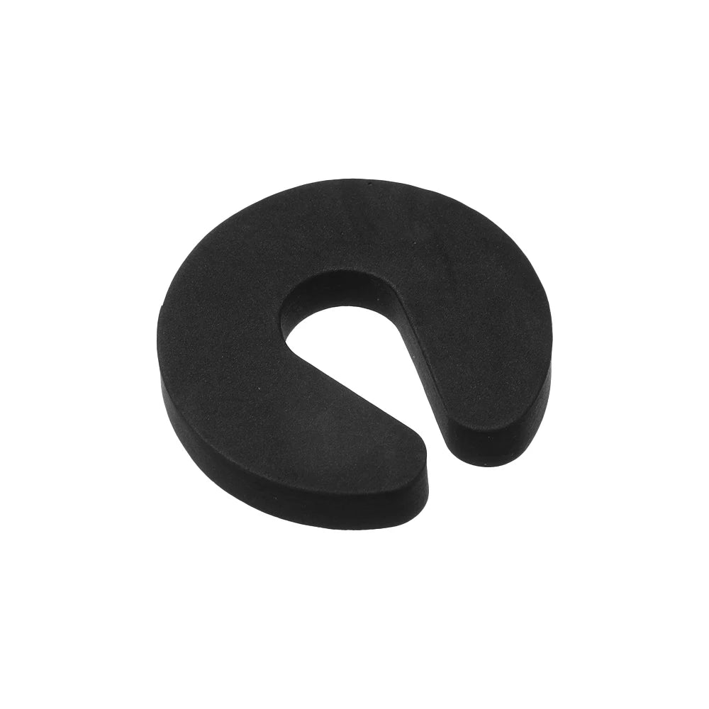 Black foam door stopper designed with a finger pinch protection feature.