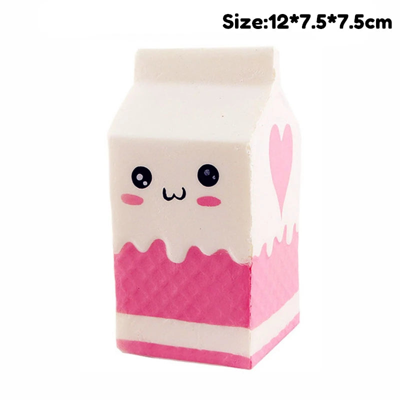 A white squishy toy shaped like a block with pink accents and a heart detail.