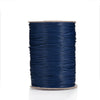 A spool of dark blue waxed cotton cord used for jewelry making.