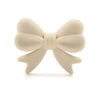 A light beige food-grade silicone bow or ribbon for jewelry making and DIY crafts.