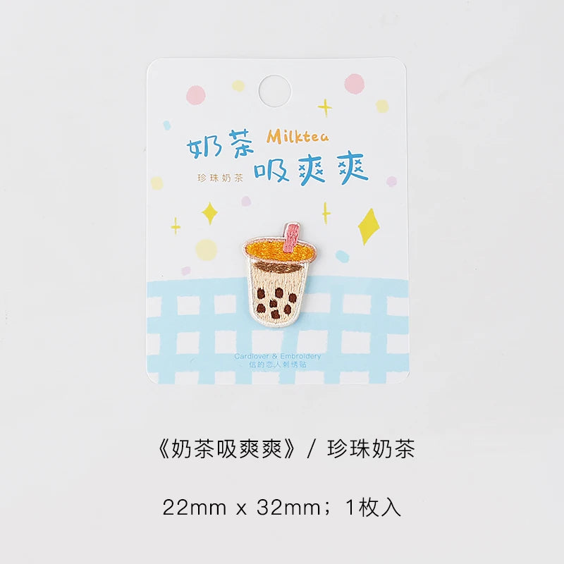 An embroidered iron-on patch featuring a cute illustration of a milk tea drink.