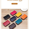 A collection of twelve genuine leather card holders in various colors, including red, black, yellow, and green, displayed on 