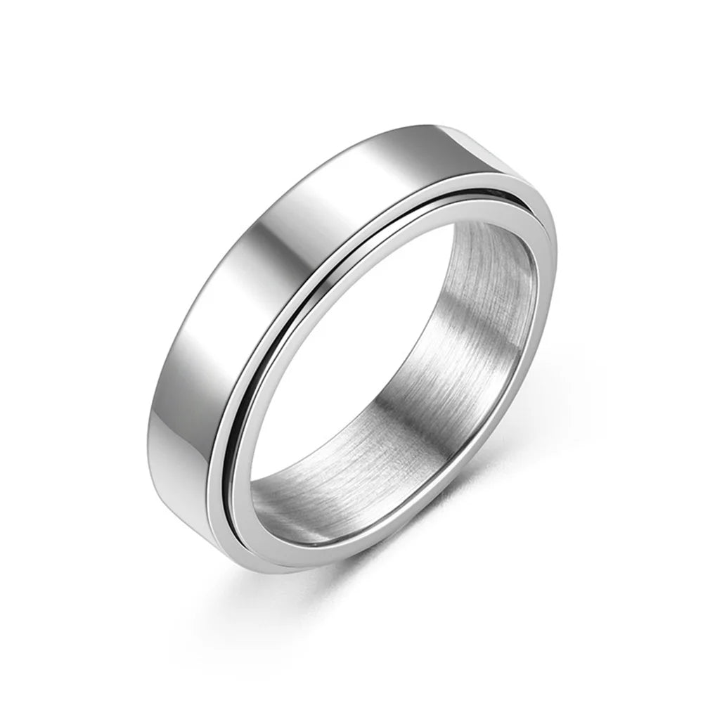 A silver stainless steel anxiety spinner ring shown in a close-up view.