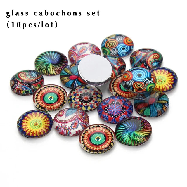 A set of ten round glass photo cabochons in various vibrant colors and patterns for jewelry making.