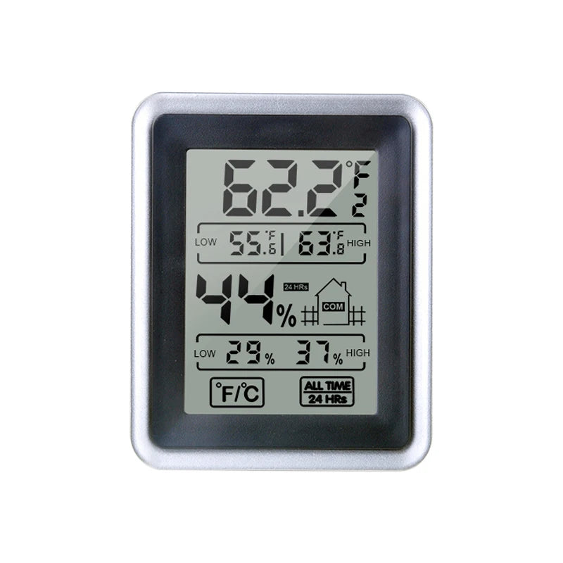 A silver digital thermometer and hygrometer displaying a temperature of 62.2 degrees Fahrenheit.