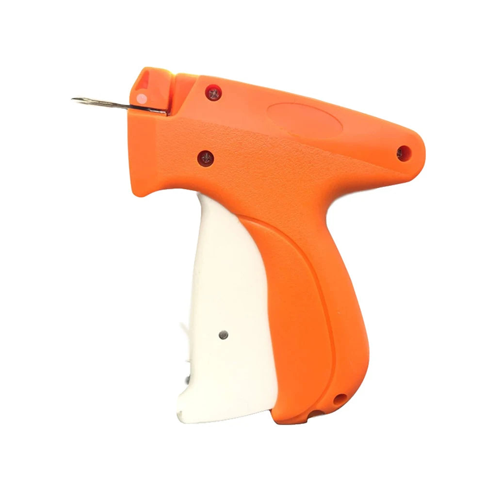 Orange handheld tagging gun with a white grip and a metal fastening barbs visible.