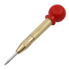 A gold and red spring-loaded automatic center punch tool with a sharp point.