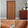 Close-up of wood grain self-adhesive wallpaper showing a natural brown texture applied to a door and furniture.