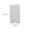 A white foldable silicone washboard with non-slip suction cups shown from the top view.