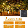 Solar fairy string lights illuminating a garden path with an arched light display and an ON/OFF mode switch.