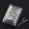 A clear plastic box containing a multi-pack of sewing machine needles with gold lettering on the packaging.