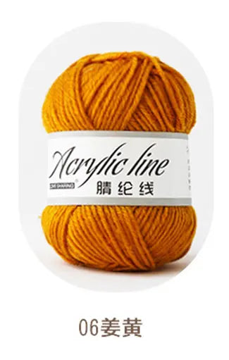 A ball of orange acrylic yarn labeled 06姜黃 (Turmeric) for knitting and crochet.