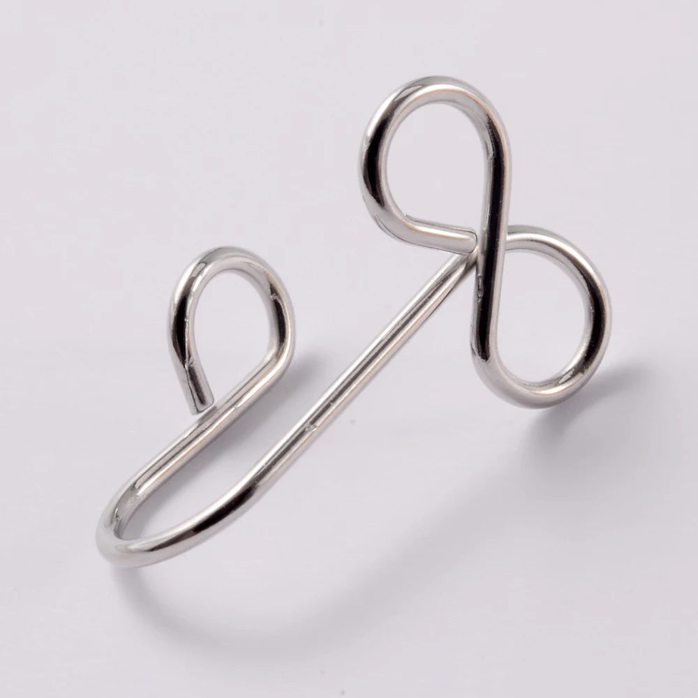 A silver spiral non-piercing nose ring made of surgical steel.