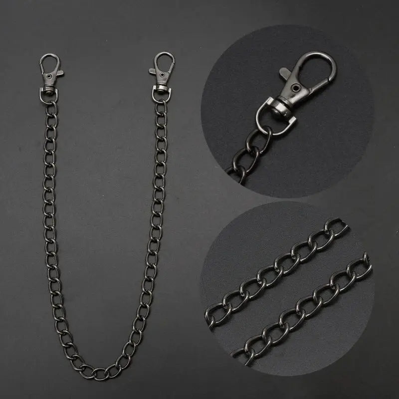 A silver chrome steel punk chain necklace and a keyring are displayed against a dark background.