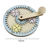 A wooden Montessori busy board featuring interlocking gears and a handle for toddlers.