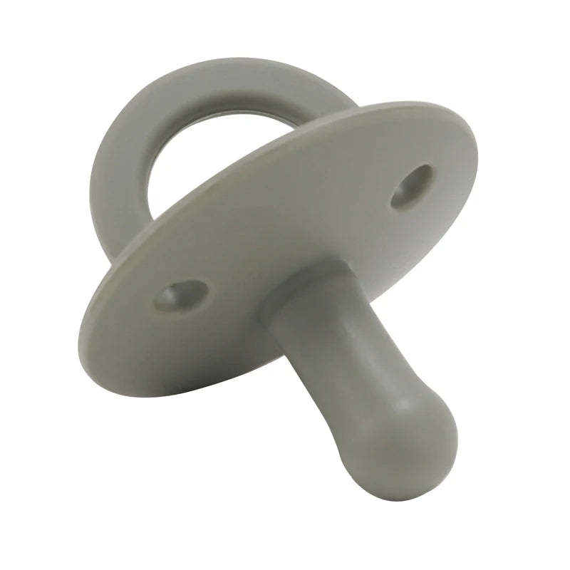 A light gray silicone baby pacifier soother with a ring and a handle.