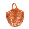 A reusable orange organic cotton mesh produce bag with a drawstring top.