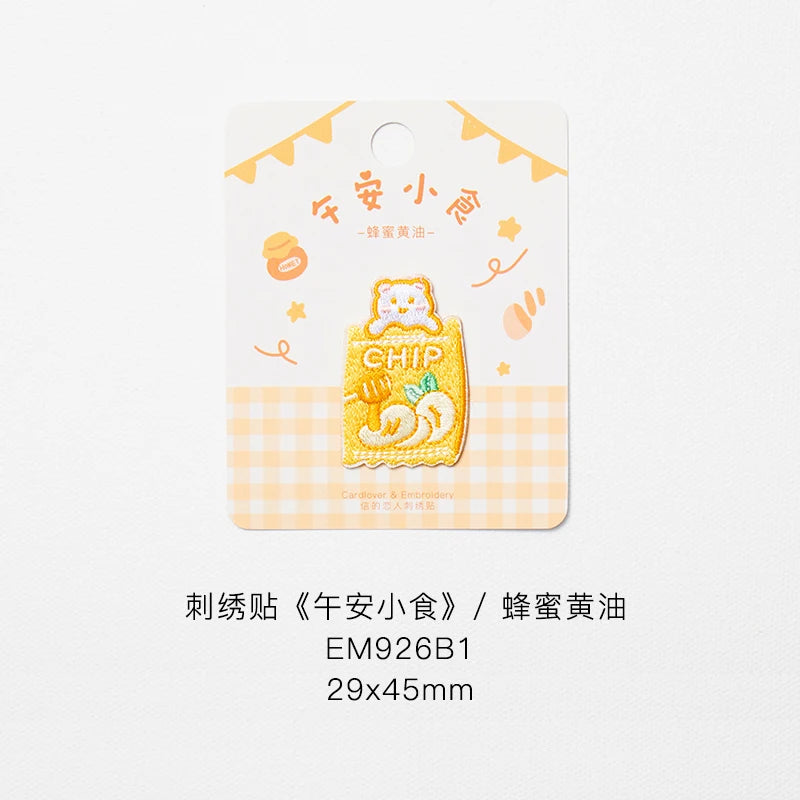 A yellow embroidered iron-on patch featuring a cute chip mascot on a light orange background.